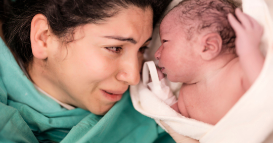 Mother looking at baby she birthed