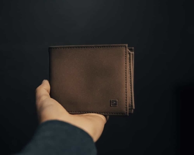 hand holding a wallet