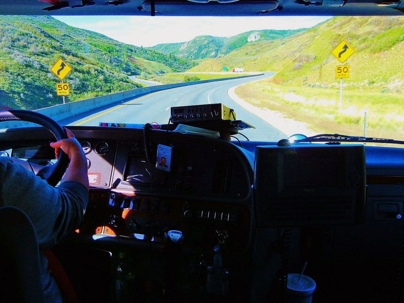 driver's view of a big truck approaching a blind turn