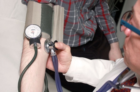 doctor taking blood pressure