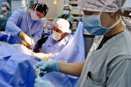 doctors in an operating room performing surgery