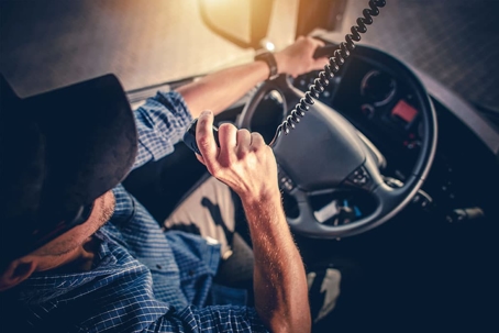 big rig driver driving using his HAM radio