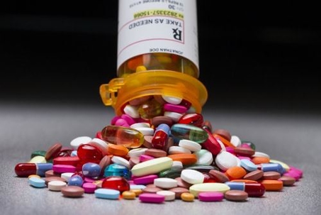 Pills falling out of prescription pill bottle