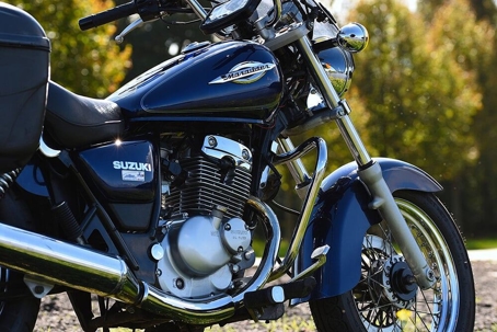 close up of black Suzuki motorcycle