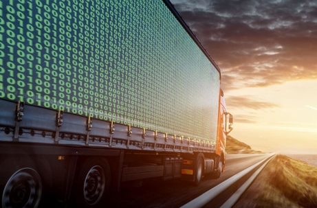 truck driving with binary code on the side