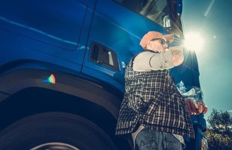 truck driver getting out of his truck