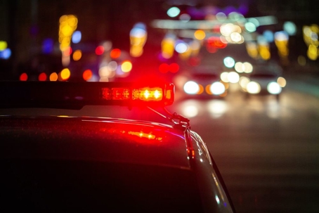 close up of a red light on top of a police car