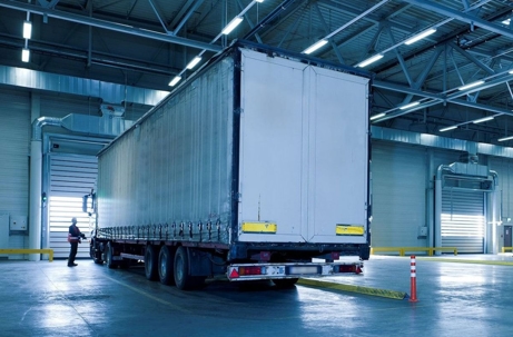 semi truck in an empty warehouse