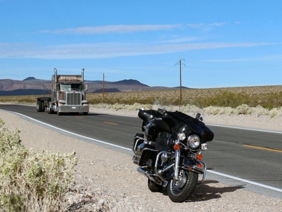 motorcycle pulled over on the side of an open road